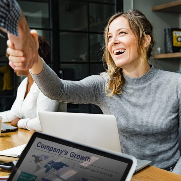 A woman giving a high five to another person.