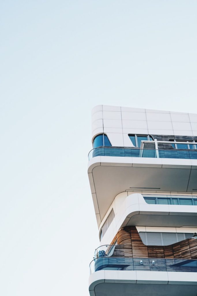 A building with a balcony on the top of it